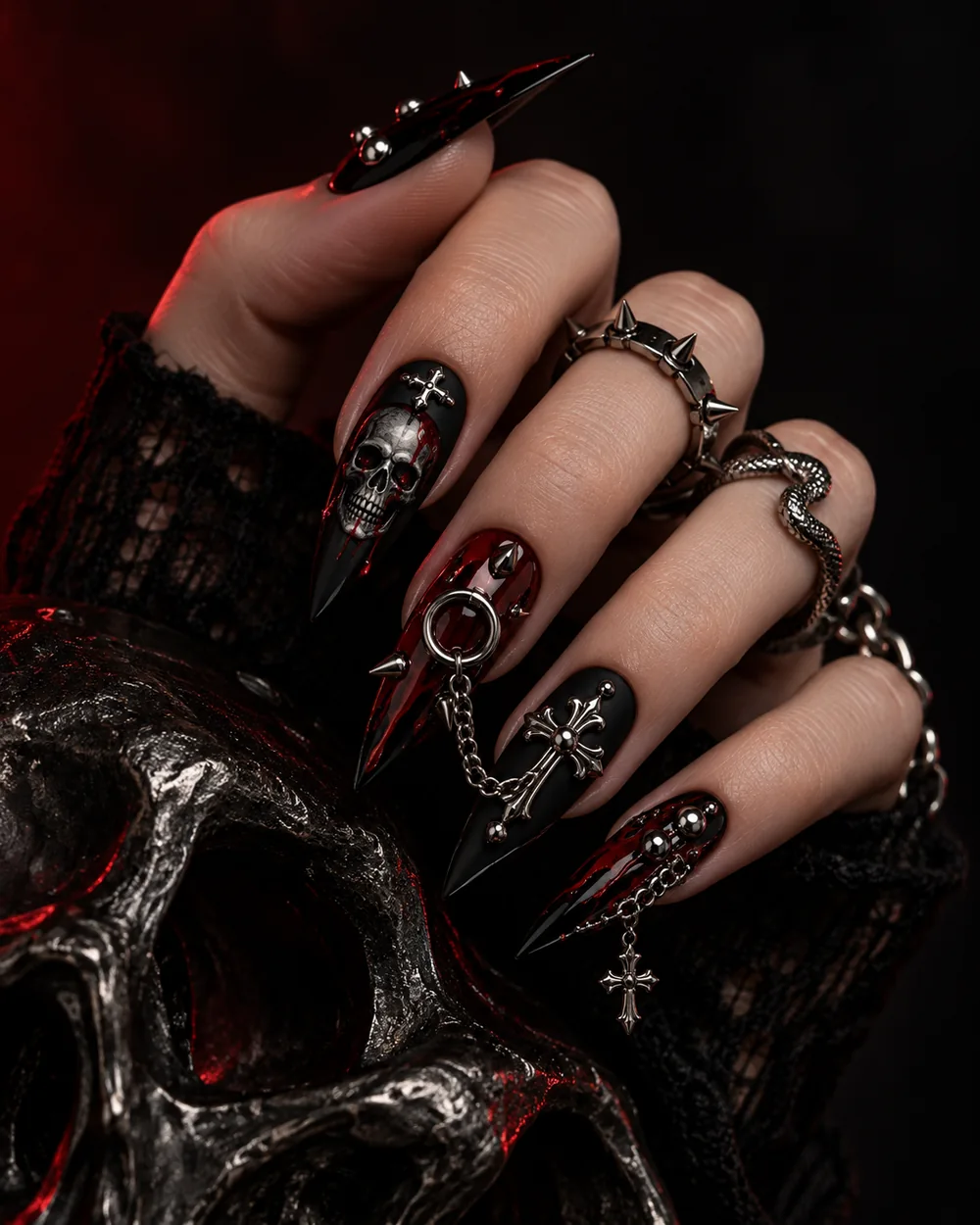 Two hands wearing black and red alternative press-on nails